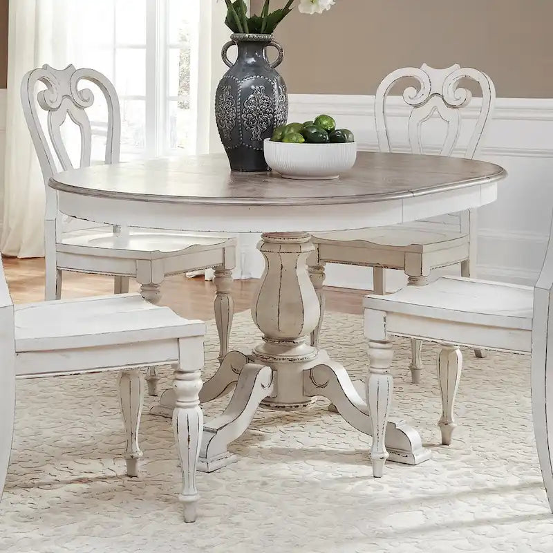 Tavolo da pranzo rotondo Magnolia Manor con base a piedistallo e prolunghe – 2 finiture