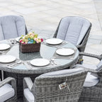 Set da pranzo rotondo da esterno in 7 pezzi in vimini di rattan con cuscini di Moda Furnishings