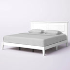 Letto a piattaforma in rovere massello con gambe affusolate e testiera