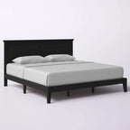 Letto a piattaforma in rovere massello con gambe affusolate e testiera