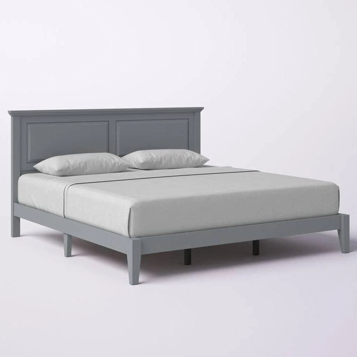 Letto a piattaforma in rovere massello con gambe affusolate e testiera