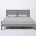 Letto a piattaforma in rovere massello con gambe affusolate e testiera