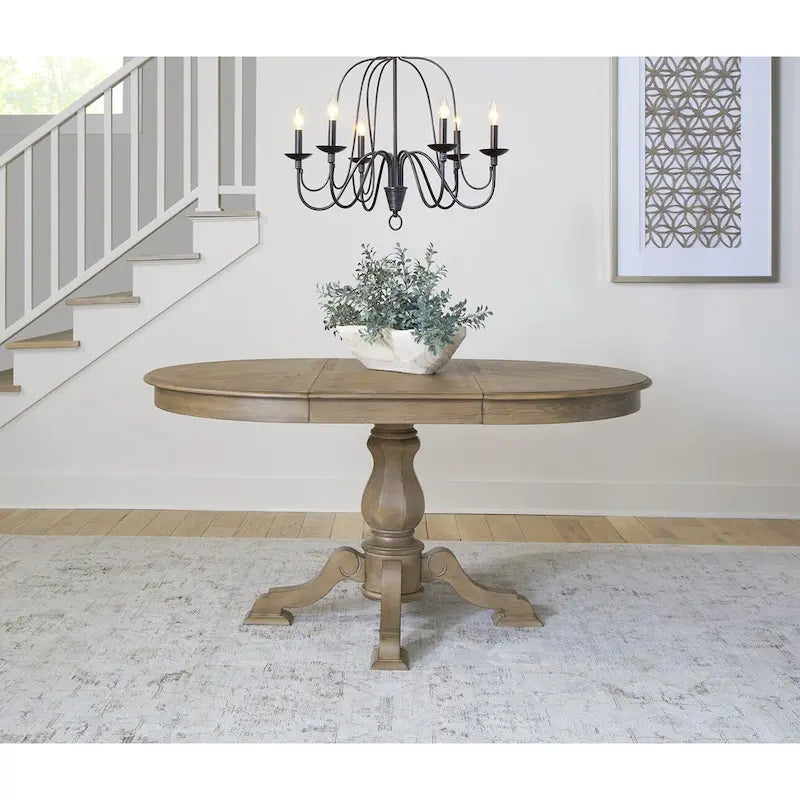 Tavolo da pranzo rotondo Magnolia Manor con base a piedistallo e prolunghe – 2 finiture